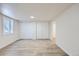 Bright bedroom with two closets, window and wood-look floors at 6010 S Garland Way, Littleton, CO 80123