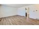 Bright and airy living room with newly installed floors and fresh paint ready for your personal touches at 6010 S Garland Way, Littleton, CO 80123