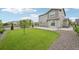 Backyard with grass lawn, wooden fence, and concrete patio at 12854 Clearview St, Firestone, CO 80504