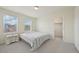 Sunlit bedroom featuring two windows with blinds and a closet at 12854 Clearview St, Firestone, CO 80504