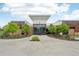 Exterior view of community clubhouse entrance featuring modern architectural design and inviting landscaping at 12854 Clearview St, Firestone, CO 80504