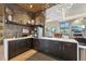 Community coffee bar with modern appliances, sleek cabinetry, and ample counter space for residents at 12854 Clearview St, Firestone, CO 80504