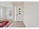 Bright foyer with wood floors and a view of the front door at 12854 Clearview St, Firestone, CO 80504