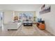 Comfortable living room with hardwood floors, neutral tones, and plenty of natural light at 12854 Clearview St, Firestone, CO 80504