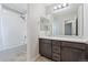 Bright bathroom features an extended vanity, shower-tub combination, and neutral finishes at 15957 E Elk Pl, Denver, CO 80239