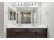Bathroom showcasing double vanity, bright lighting, and large mirror at 15957 E Elk Pl, Denver, CO 80239