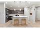 Modern kitchen features pendant lighting over the island, stainless steel appliances, and sleek countertops at 15957 E Elk Pl, Denver, CO 80239