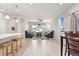 Open-concept living room with neutral walls, lots of natural light, and modern furnishings at 15957 E Elk Pl, Denver, CO 80239