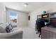 Comfortable office space with a built-in desk, couch, and a bright window at 15957 E Elk Pl, Denver, CO 80239