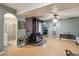 Living room with wood-burning stove, and arched doorways at 650 4Th St, Bennett, CO 80102