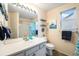 Nautical themed bathroom featuring a tub, shower, and white cabinets at 12261 N Holly Way, Brighton, CO 80602