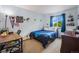 Comfortable bedroom with ample light, carpeted floors and ceiling fan at 12261 N Holly Way, Brighton, CO 80602