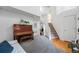 Bright entryway boasts an upright piano, staircase, and an abundance of natural light streaming through multiple windows at 12261 N Holly Way, Brighton, CO 80602