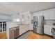 Well-appointed kitchen featuring stainless steel appliances, tiled backsplash, and ample cabinet space at 12261 N Holly Way, Brighton, CO 80602