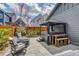 Outdoor patio with a hot tub, gazebo, fire pit, and hardscaped patio area for relaxing and entertaining at 8444 E 55Th Pl, Denver, CO 80238