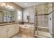 Luxurious bathroom with soaking tub, walk-in shower, and stylish vanity at 8444 E 55Th Pl, Denver, CO 80238