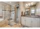 Bathroom featuring walk-in shower, bathtub, vanity with dual sinks and tile flooring at 8444 E 55Th Pl, Denver, CO 80238