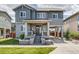 Charming two-story home featuring a welcoming front porch and well-maintained lawn with a carport at 8444 E 55Th Pl, Denver, CO 80238