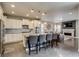 Open-concept kitchen with stainless steel appliances, granite countertops, and a breakfast bar at 8444 E 55Th Pl, Denver, CO 80238