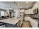 Open kitchen featuring granite counters, white cabinets, stainless appliances, and gray backsplash at 8444 E 55Th Pl, Denver, CO 80238