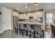 Well-lit kitchen boasts stainless appliances, granite counters, pendant lighting, and gray backsplash at 8444 E 55Th Pl, Denver, CO 80238