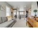Cozy loft area with a couch and piano, perfect for relaxation or entertainment at 8444 E 55Th Pl, Denver, CO 80238