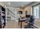Bright office space with French doors, modern desk setup, and ample natural light at 8444 E 55Th Pl, Denver, CO 80238