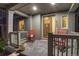 Inviting covered porch with rocking chairs and stylish decor at 8444 E 55Th Pl, Denver, CO 80238
