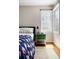 Cozy bedroom with natural light, colorful accents, and hardwood flooring at 407 S White Tail Dr, Franktown, CO 80116