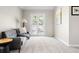 Cozy living room with plush carpeting, neutral tones, and a private patio at 407 S White Tail Dr, Franktown, CO 80116