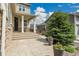 Inviting front porch with stone accents, landscaping, and a welcoming entrance at 6401 Leilani Ln, Castle Rock, CO 80108