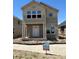 New two-story home boasts a welcoming front porch and modern design elements at 54 Waterford St, Erie, CO 80516