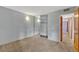 Serene bedroom with neutral walls, soft carpet, and mirrored closet doors at 2227 Canyon Blvd # 312A, Boulder, CO 80302