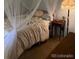 Charming bedroom with canopy bed and soft decor at 2227 Canyon Blvd # 312A, Boulder, CO 80302