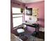 Pink bedroom with desk, window, and wall art at 2227 Canyon Blvd # 312A, Boulder, CO 80302