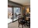 Dining area with sliding glass doors leading to balcony at 2227 Canyon Blvd # 312A, Boulder, CO 80302