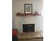 Simple fireplace with a wooden mantel at 2227 Canyon Blvd # 312A, Boulder, CO 80302