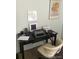 Home office features a writing desk, typewriter, and framed art at 2227 Canyon Blvd # 312A, Boulder, CO 80302