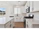 A modern kitchen featuring stainless steel appliances, a gas stove and stone countertops at 1392 Rock Cliff Ave, Erie, CO 80516