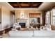 Comfortable living room with a fireplace, coffered ceilings, and a large picture window at 27485 E Nova Pl, Aurora, CO 80016