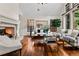 Cozy living room showcases hardwood floors, fireplace, and stylish furnishings at 1027 S Fillmore Way, Denver, CO 80209