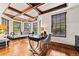 Bright home office with beautiful hardwood floors, wood trim ceiling and ample natural light at 1027 S Fillmore Way, Denver, CO 80209