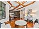 Stylish office featuring custom built-ins, hardwood floors, and an abundance of natural light at 1027 S Fillmore Way, Denver, CO 80209