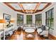 Sophisticated office space with hardwood floors, decorative trim, and large windows at 1027 S Fillmore Way, Denver, CO 80209