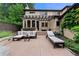 Inviting patio with comfortable seating, pergola, and lush landscaping for outdoor relaxation and entertaining at 1027 S Fillmore Way, Denver, CO 80209