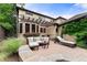 Charming outdoor patio featuring comfortable seating, a pergola, and mature landscaping, creating a serene retreat at 1027 S Fillmore Way, Denver, CO 80209