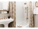 Elegant bathroom with white subway tiles, gold fixtures, and a clawfoot tub at 1305 E 13Th Ave # 1, Denver, CO 80218