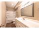 The full bathroom has a vanity with dual sinks and a shower-tub combo at 2317 Winding Dr, Longmont, CO 80504