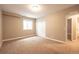 A finished bedroom has carpet, closet, window, and access to the bathroom at 2317 Winding Dr, Longmont, CO 80504