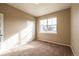 Bright bedroom featuring a large window, neutral walls, and closet at 2317 Winding Dr, Longmont, CO 80504